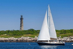 Sailboat Passes One of the Thacher Island Twin Lights